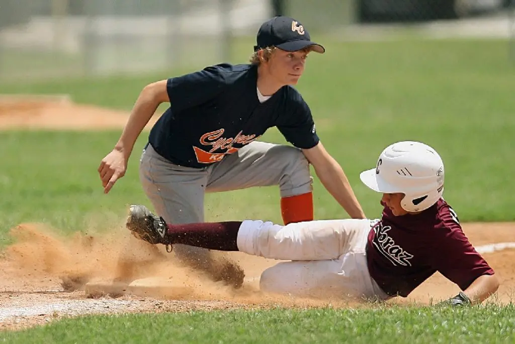 High School Baseball Player sliding